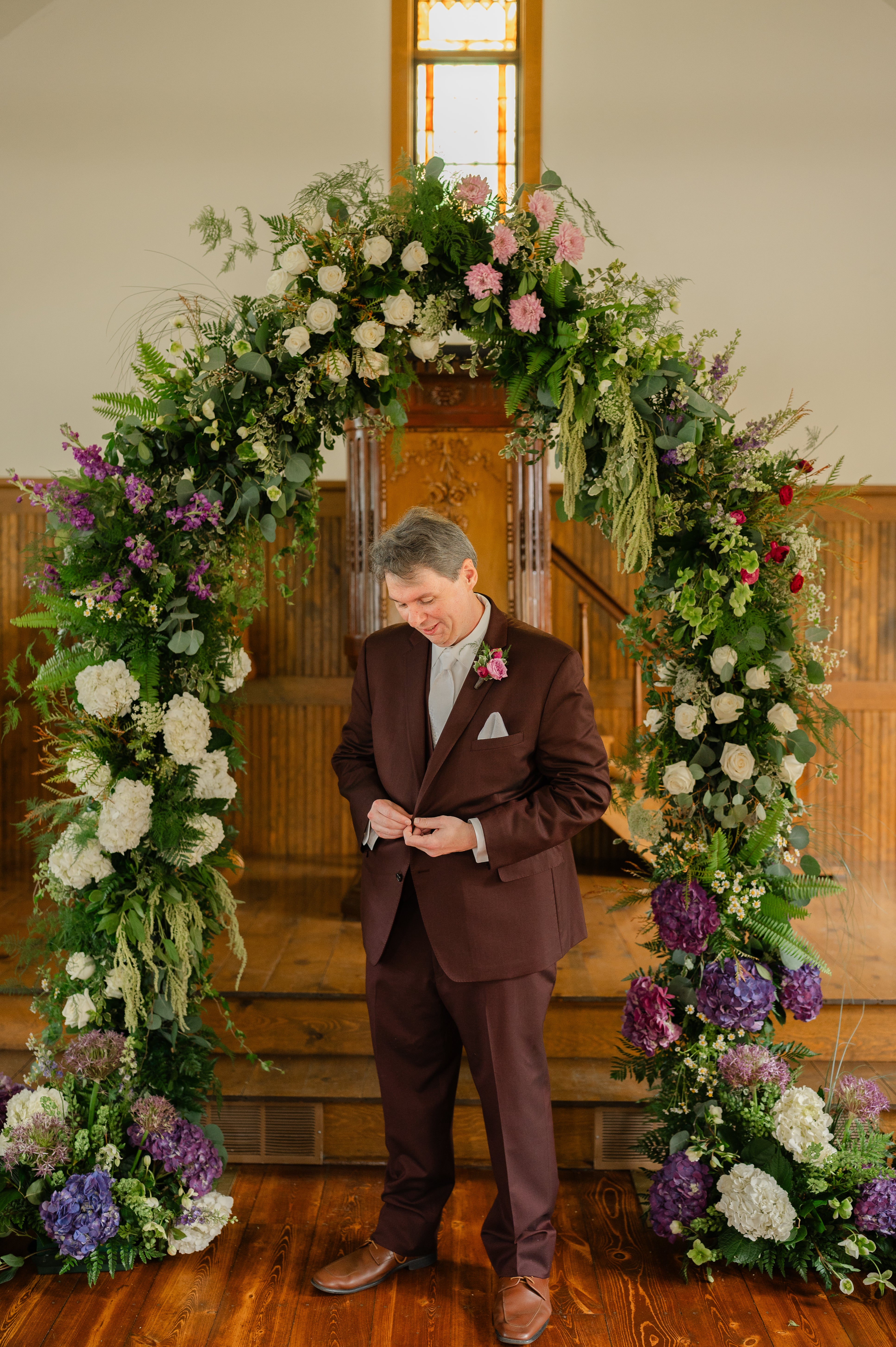 Garden-inspired floral arch with purple, white, and green flowers, Pella, Iowa